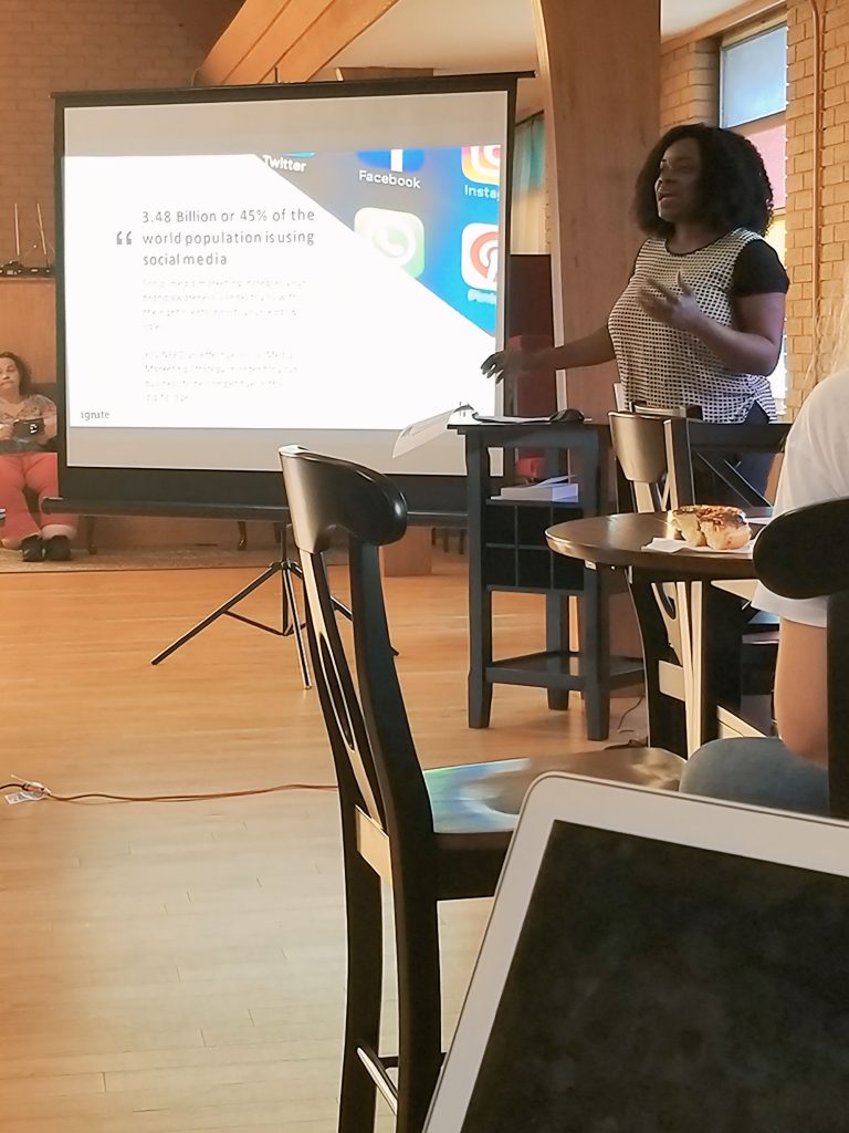 Woman standing in room teaching a class